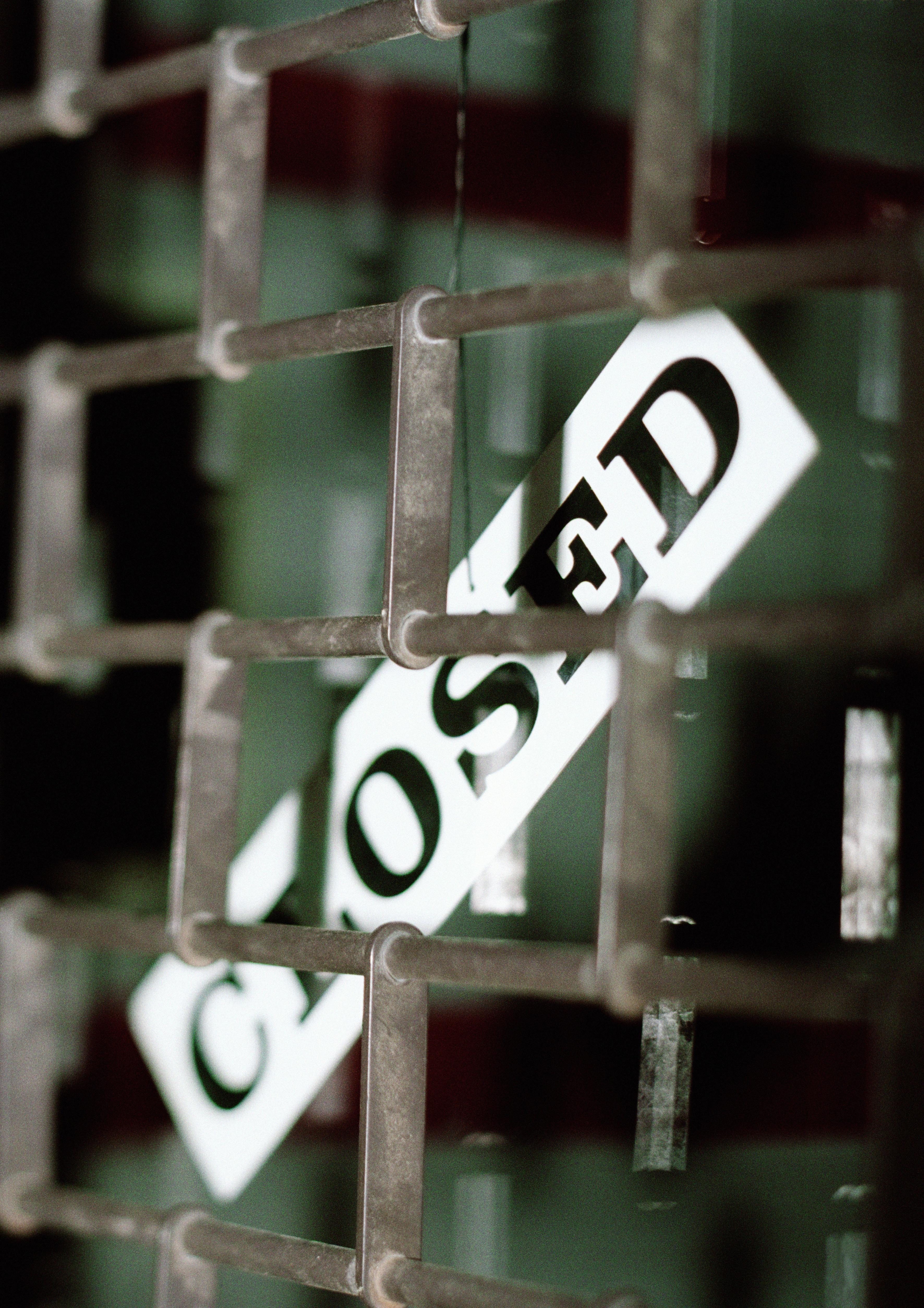 Security grille and 'closed' sign, close-up